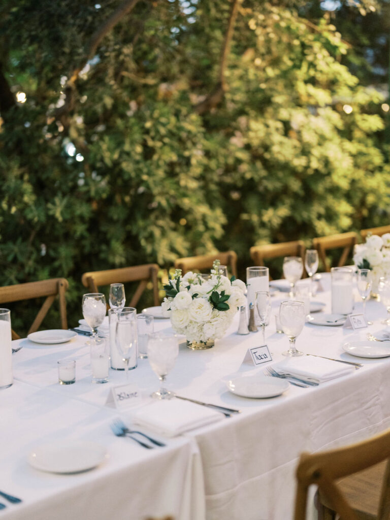 Dinner party table detail at El Chorro with candles and florals