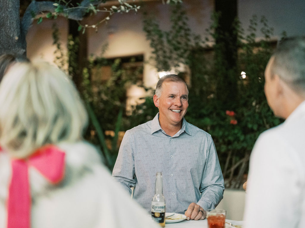 Guest smiling at El Chorro dinner party Scottsdale