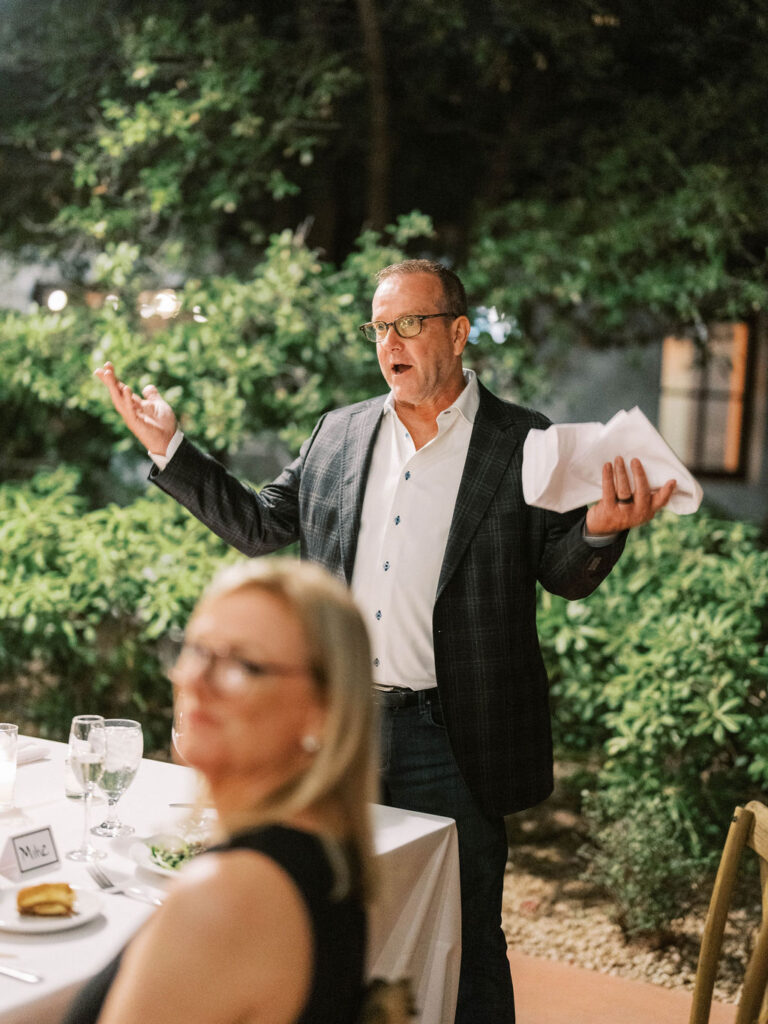 Guest giving toast at El Chorro dinner party Scottsdale