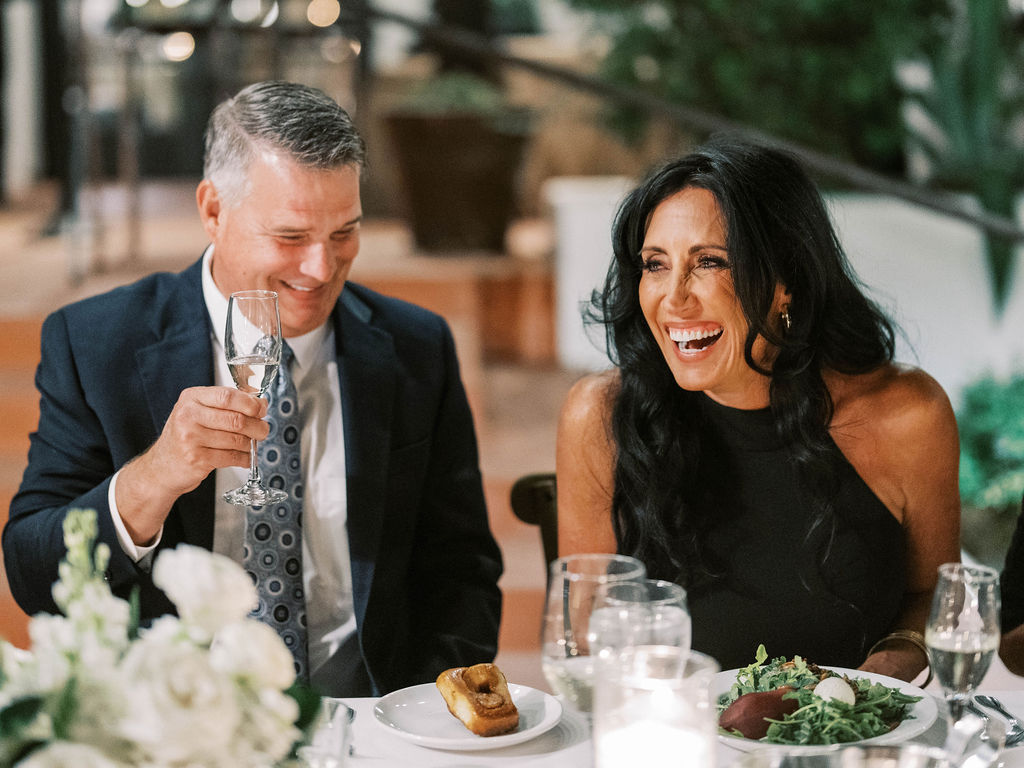 Guests laughing at El Chorro dinner party Scottsdale