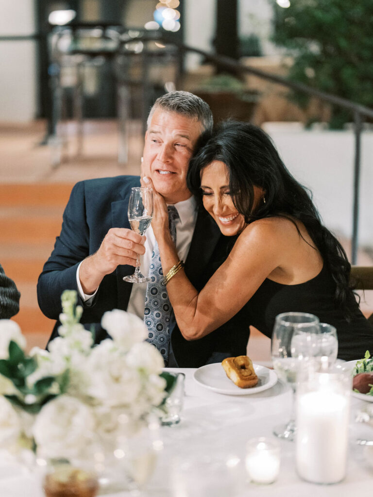 Couple embracing during El Chorro dinner party celebration