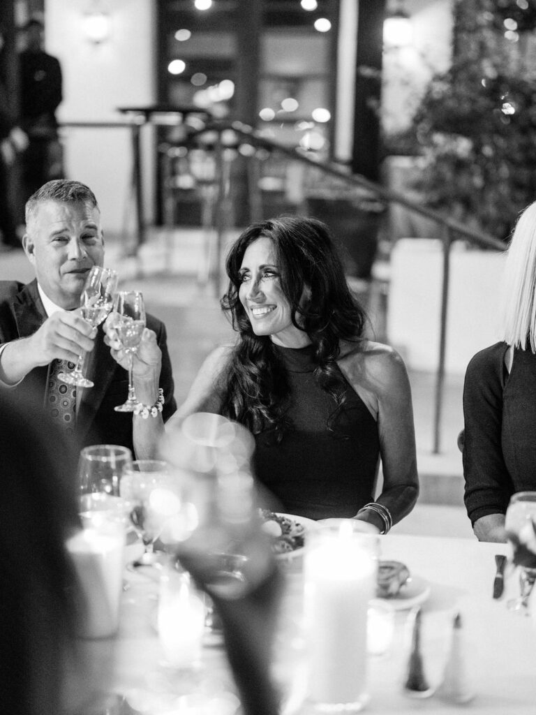 Guests laughing during dinner at El Chorro celebration
