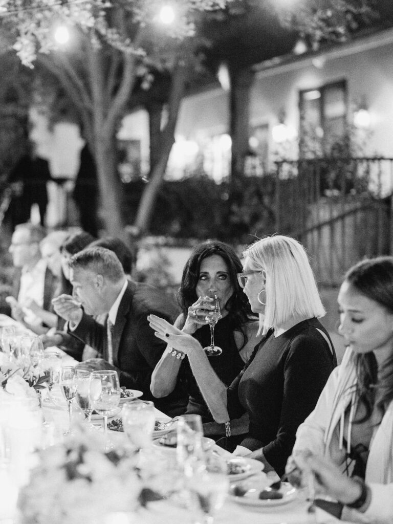Guests raising glasses at El Chorro dinner party celebration
