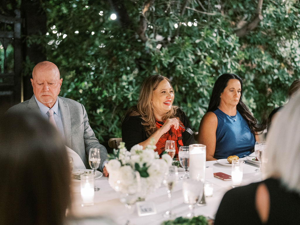 Guests seated at long table during El Chorro dinner party