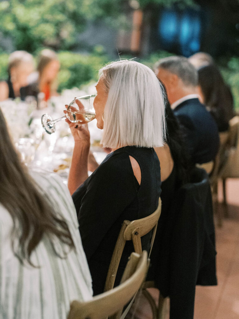Guest sipping champagne at El Chorro dinner celebration