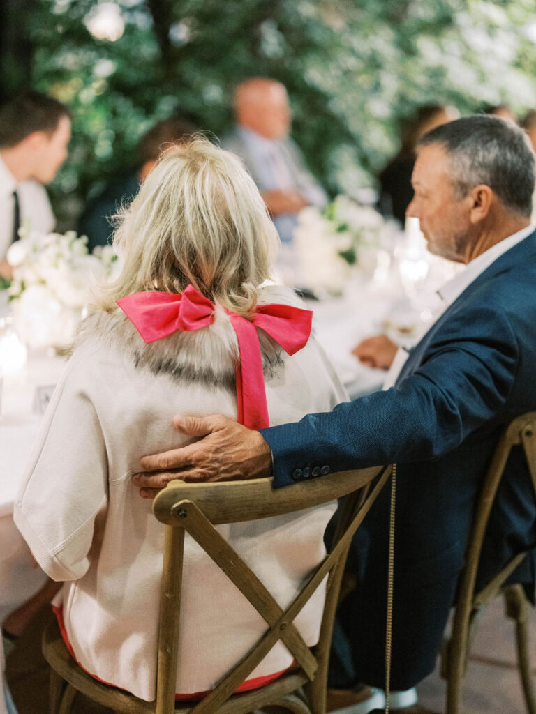 Guest with pink bow detail at El Chorro dinner party