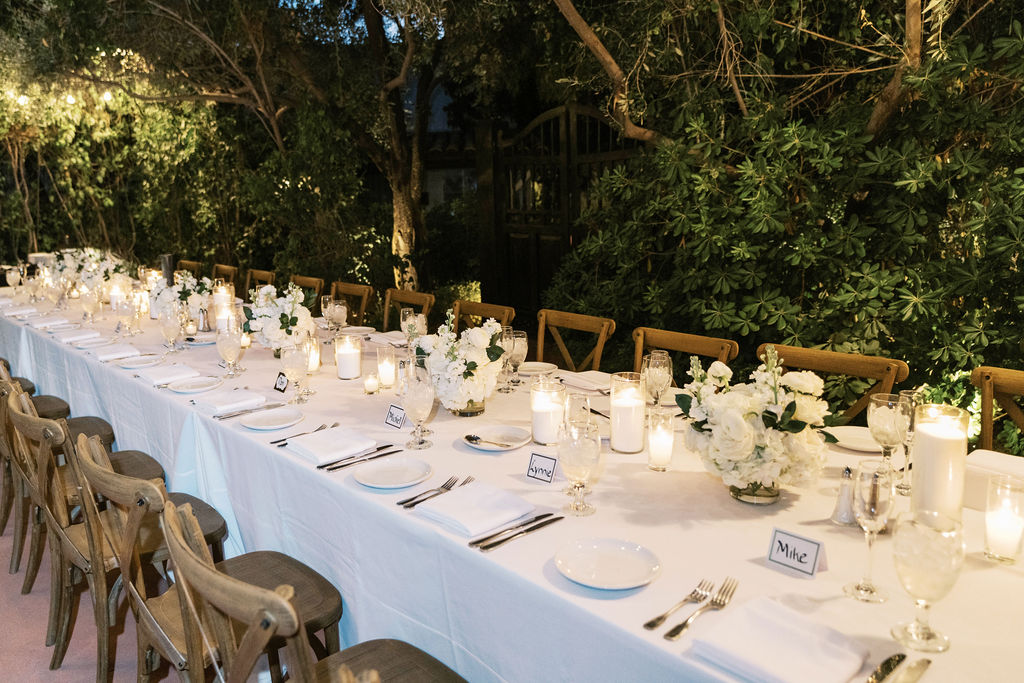 Long dinner table with candles at El Chorro outdoor party