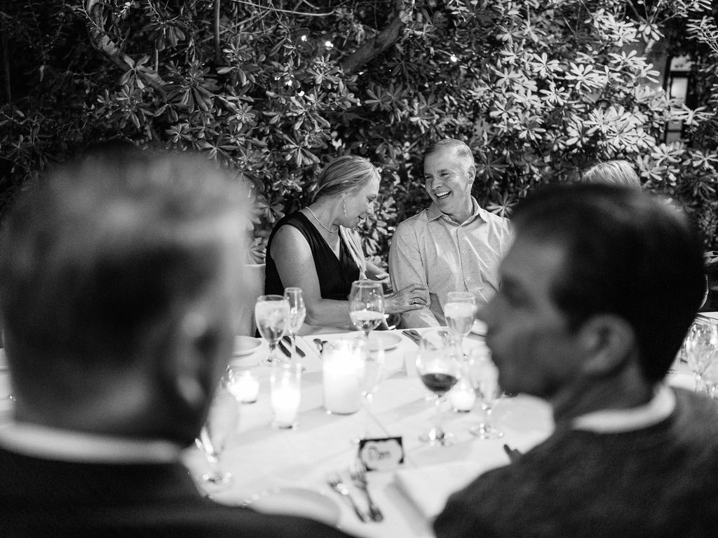 Black and white candid of guests at El Chorro dinner party