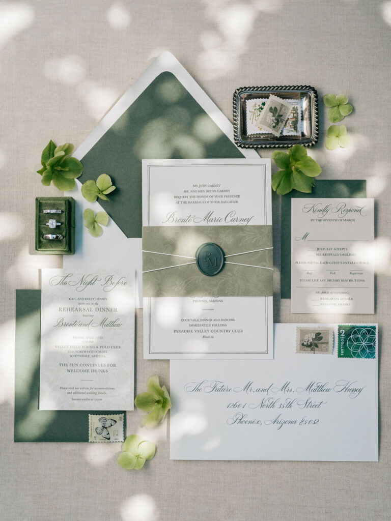 Wedding invitation suite with green and ivory details.
