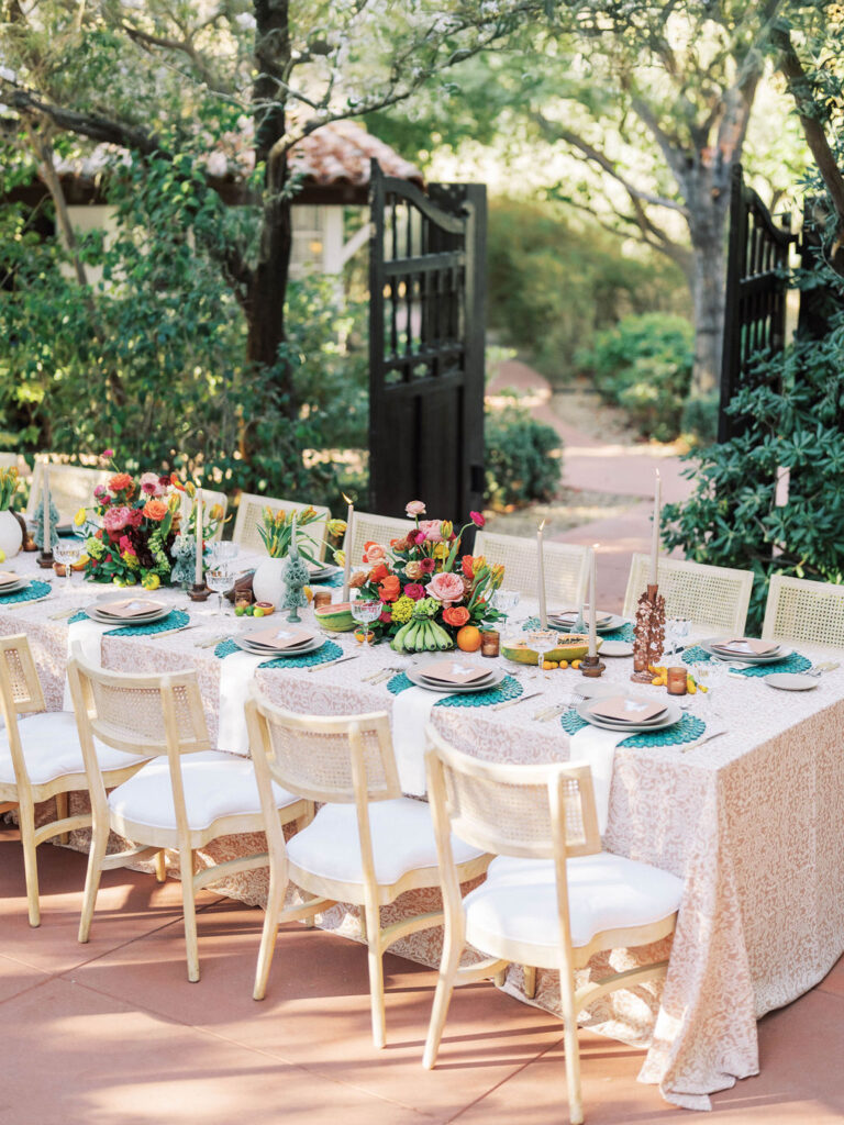 Outdoor wedding reception table with colorful florals at El Chorro.