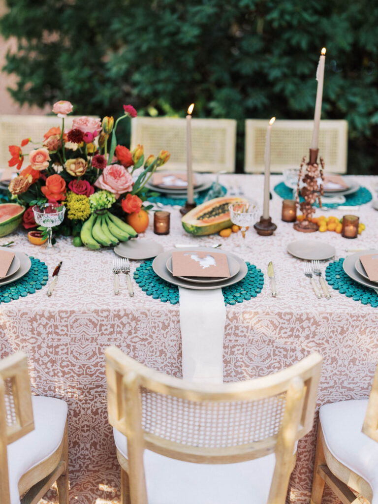 Reception tablescape with florals and candles at El Chorro.