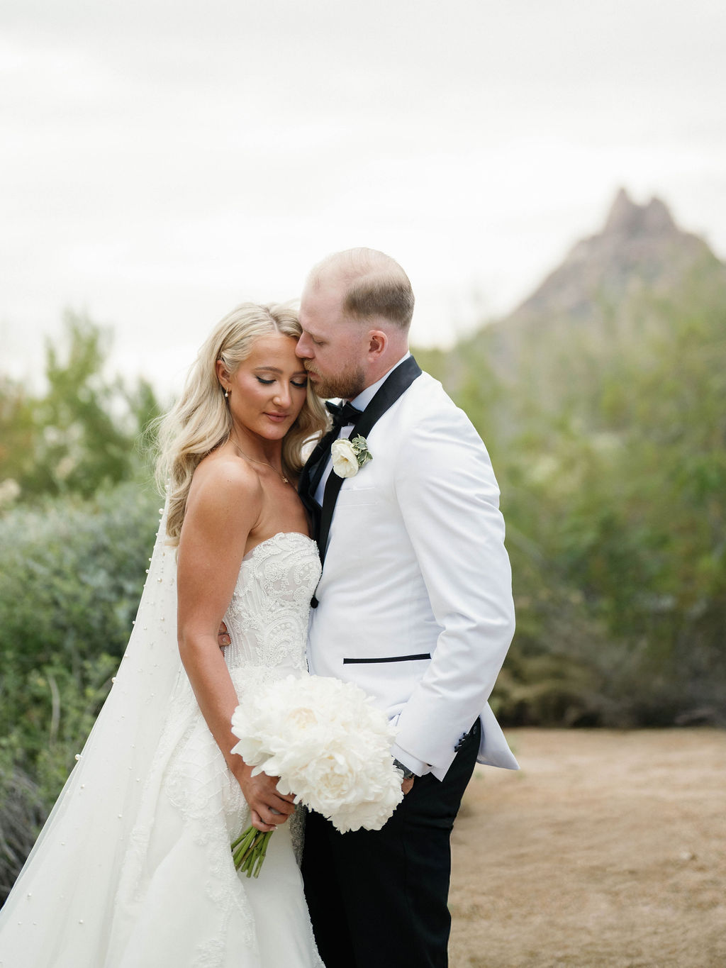 Couple portrait with Pinnacle Peak at Four Seasons Scottsdale wedding