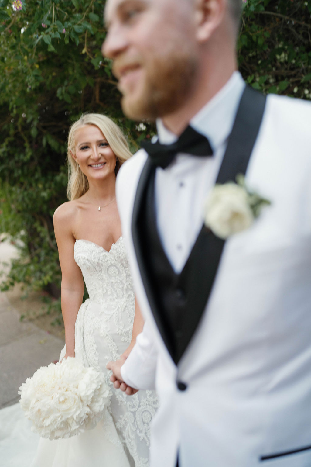 First kiss at ceremony with fountain at Four Seasons Scottsdale wedding