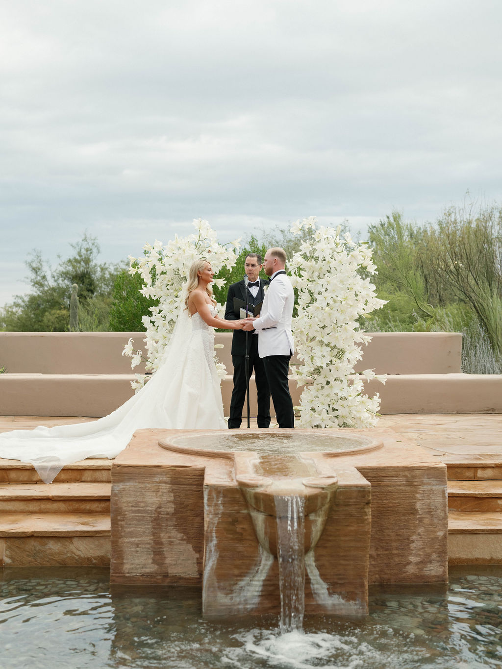 Ceremony vows with fountain backdrop at Four Seasons Scottsdale wedding