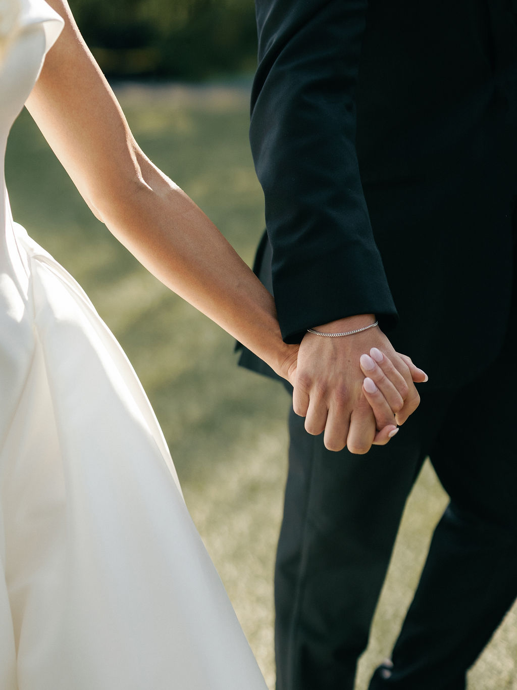 Bride and groom holding hands close-up at El Chorro Paradise Valley wedding