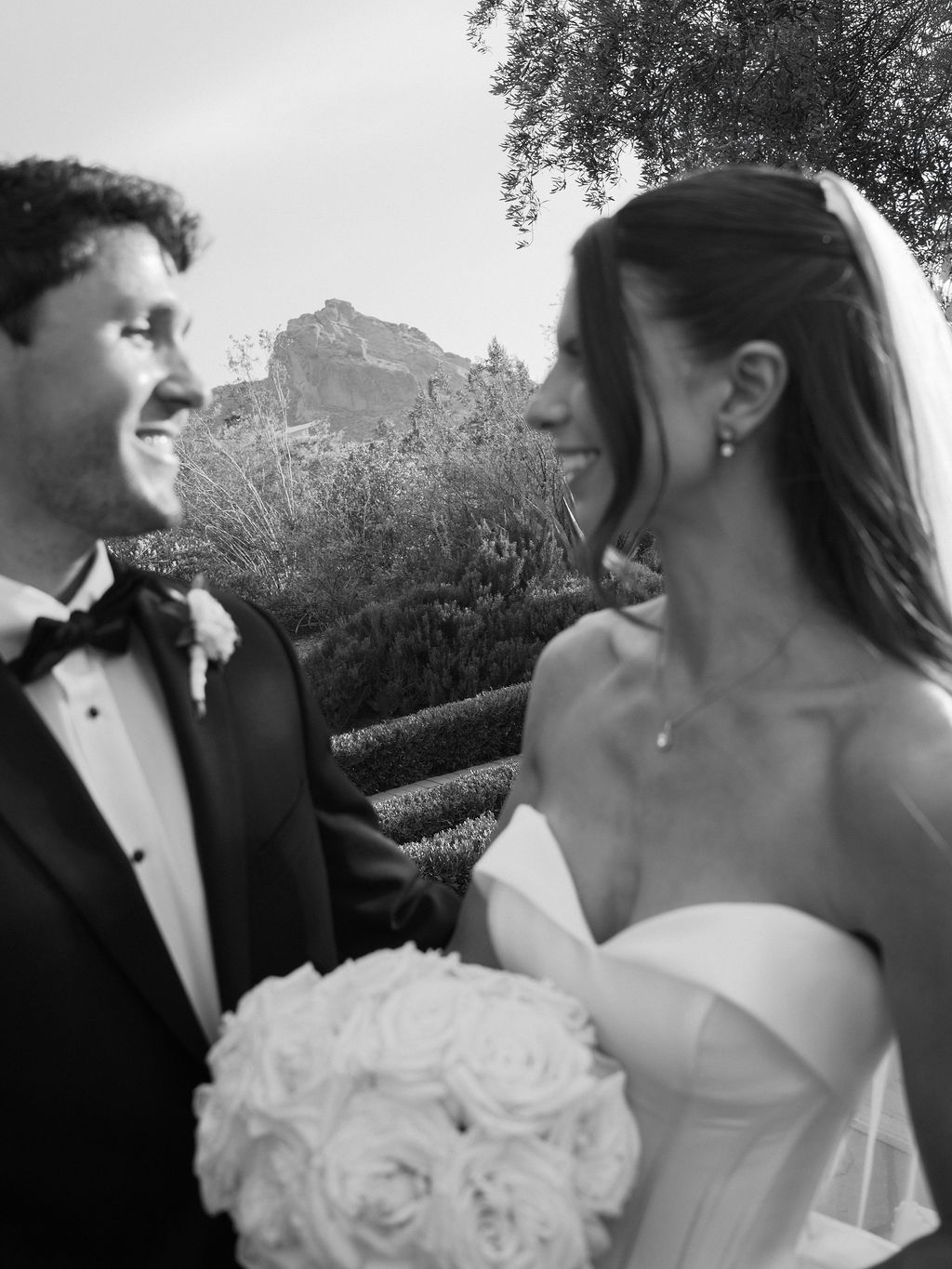 White floral ceremony arch detail with roses at El Chorro Paradise Valley wedding