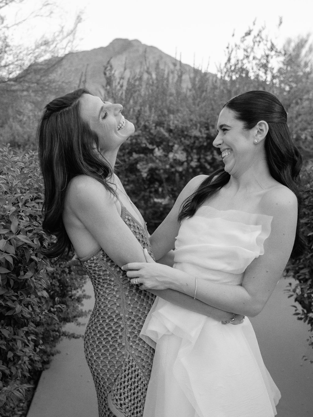 Bride laughing with a friend before her wedding at El Chorro