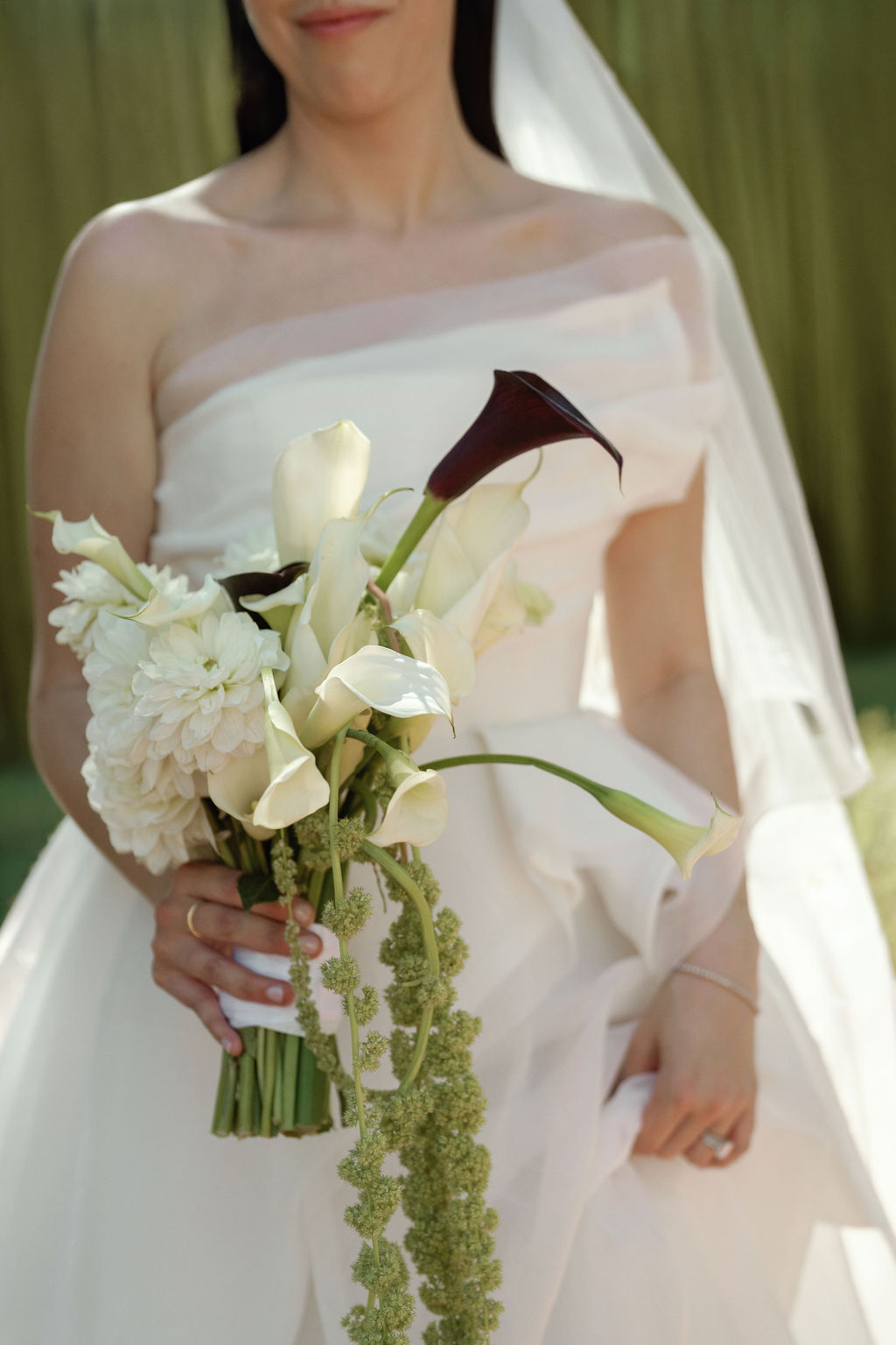 Bridal bouquet of calla lilies and dahlias