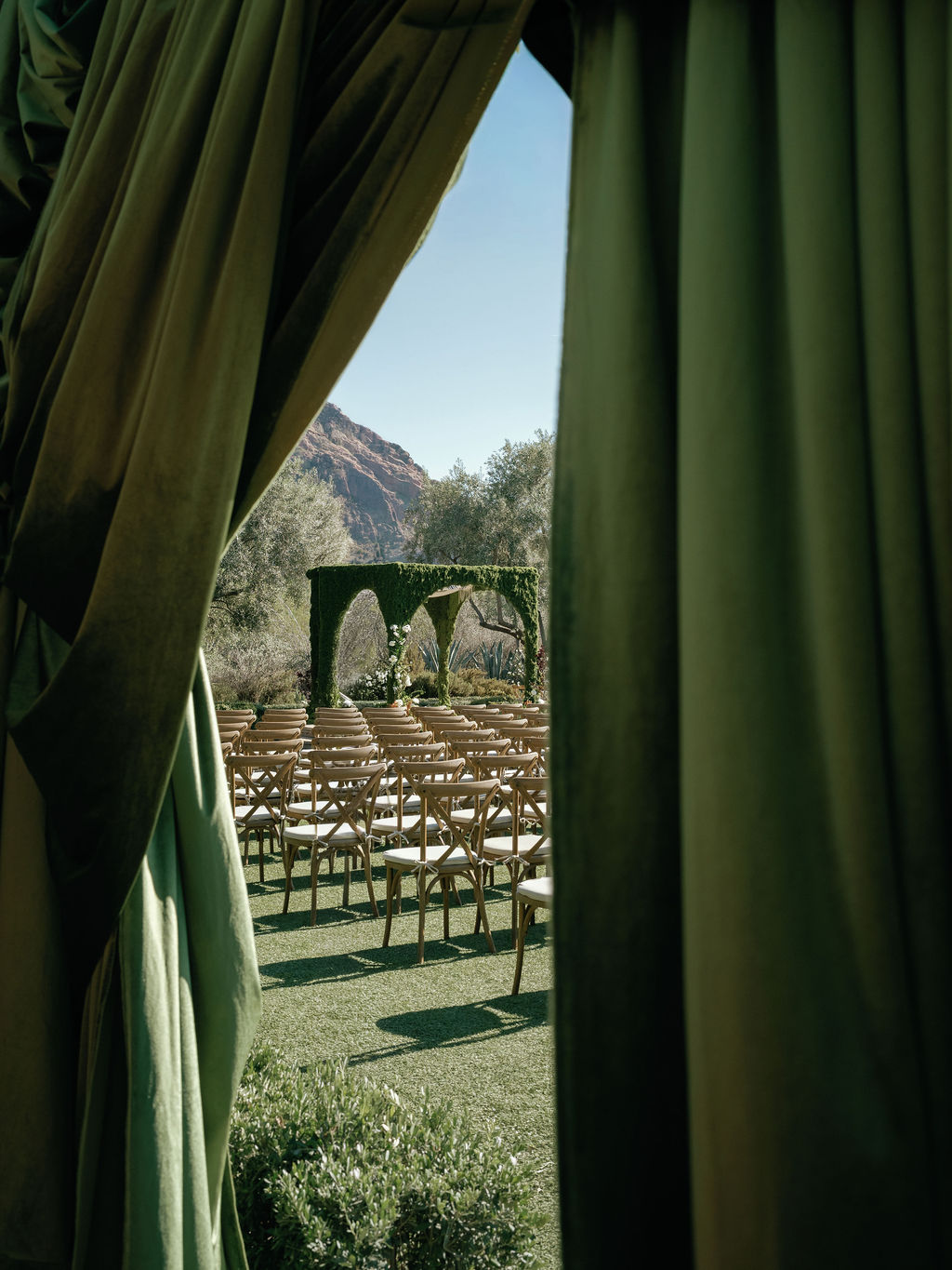 Ceremony viewed through the draped curtains at El Chorro