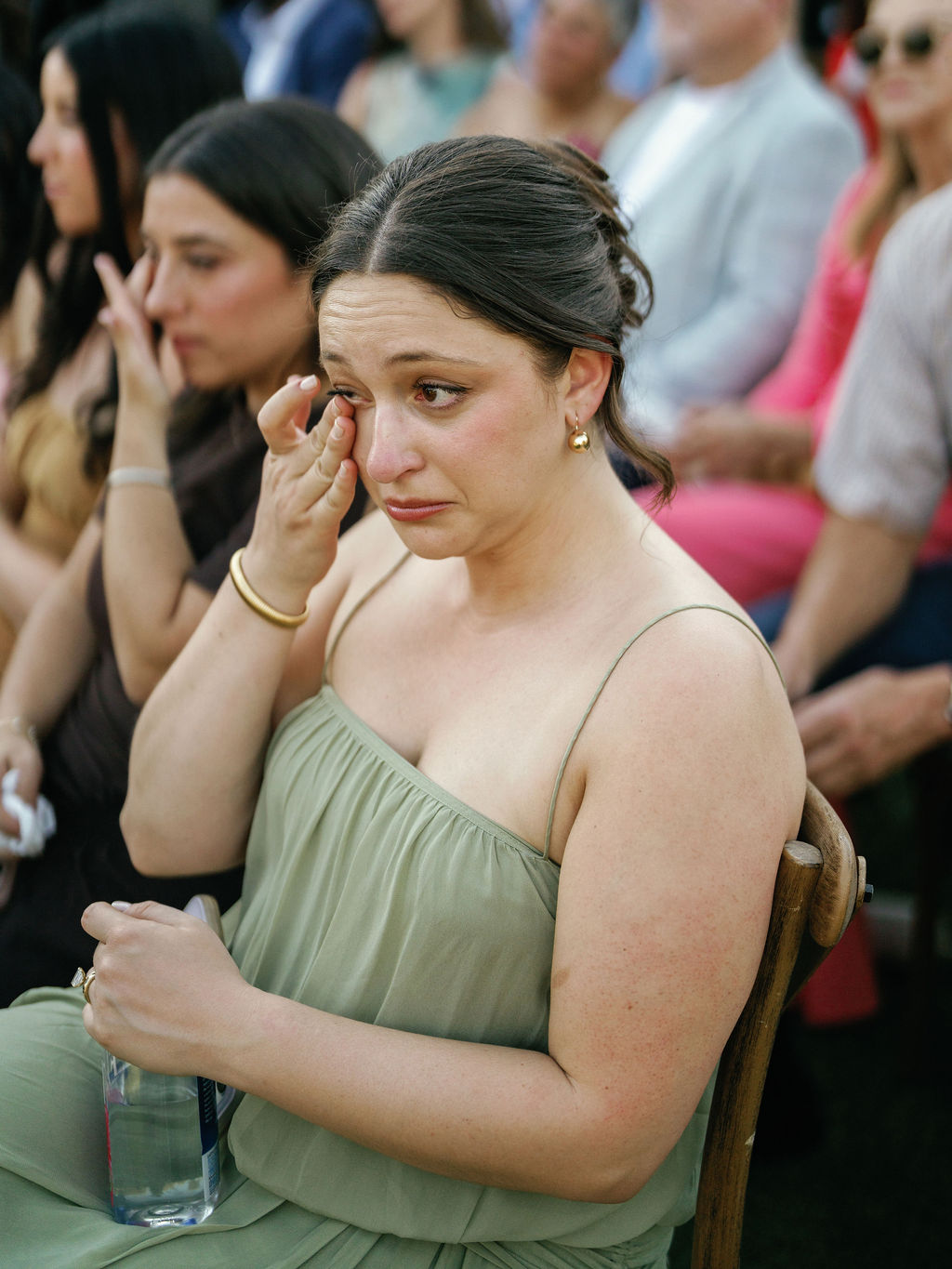 Guest wiping away tears during the ceremony