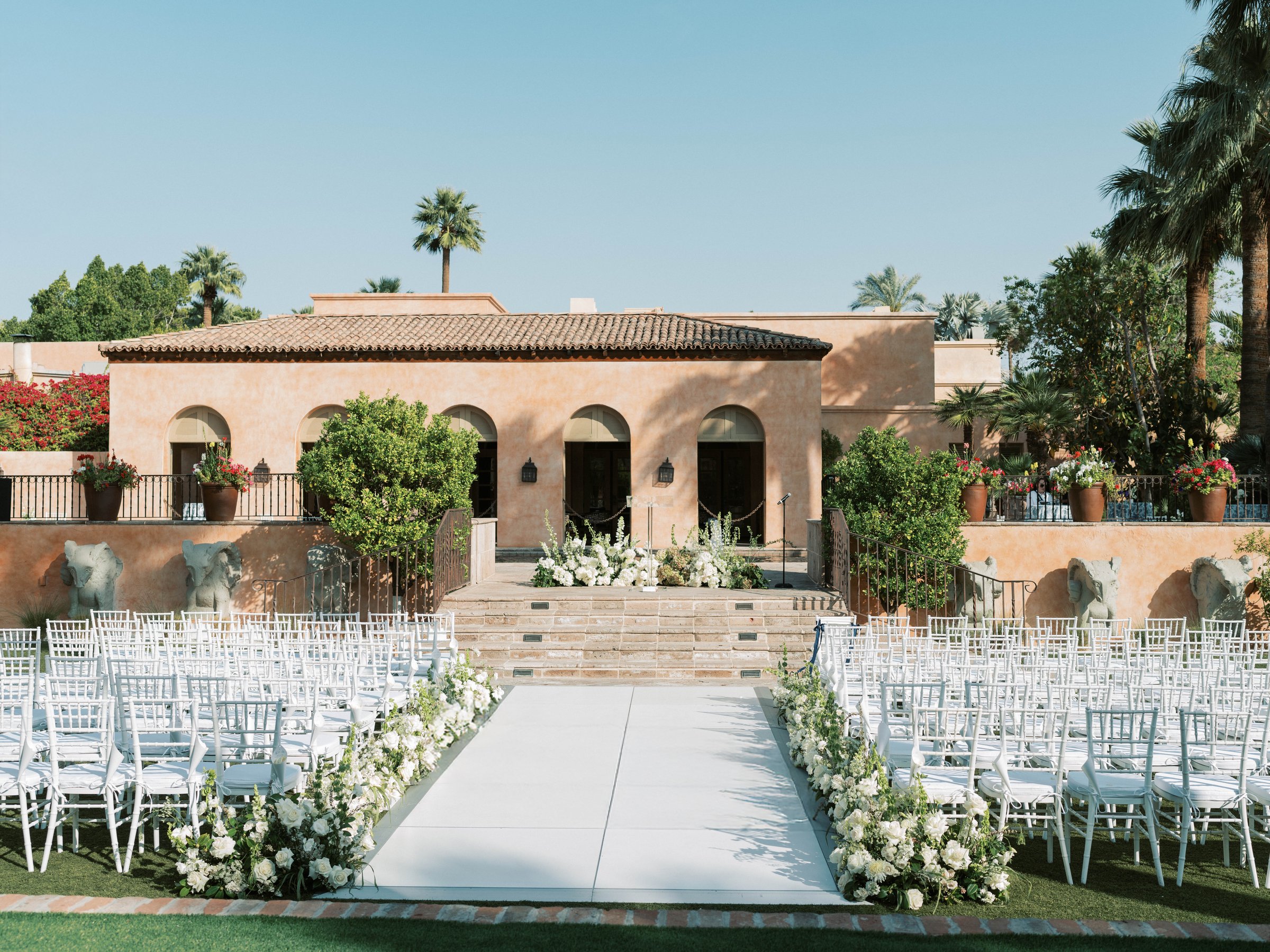 The garden ceremony aisle and arched building at Royal Palms