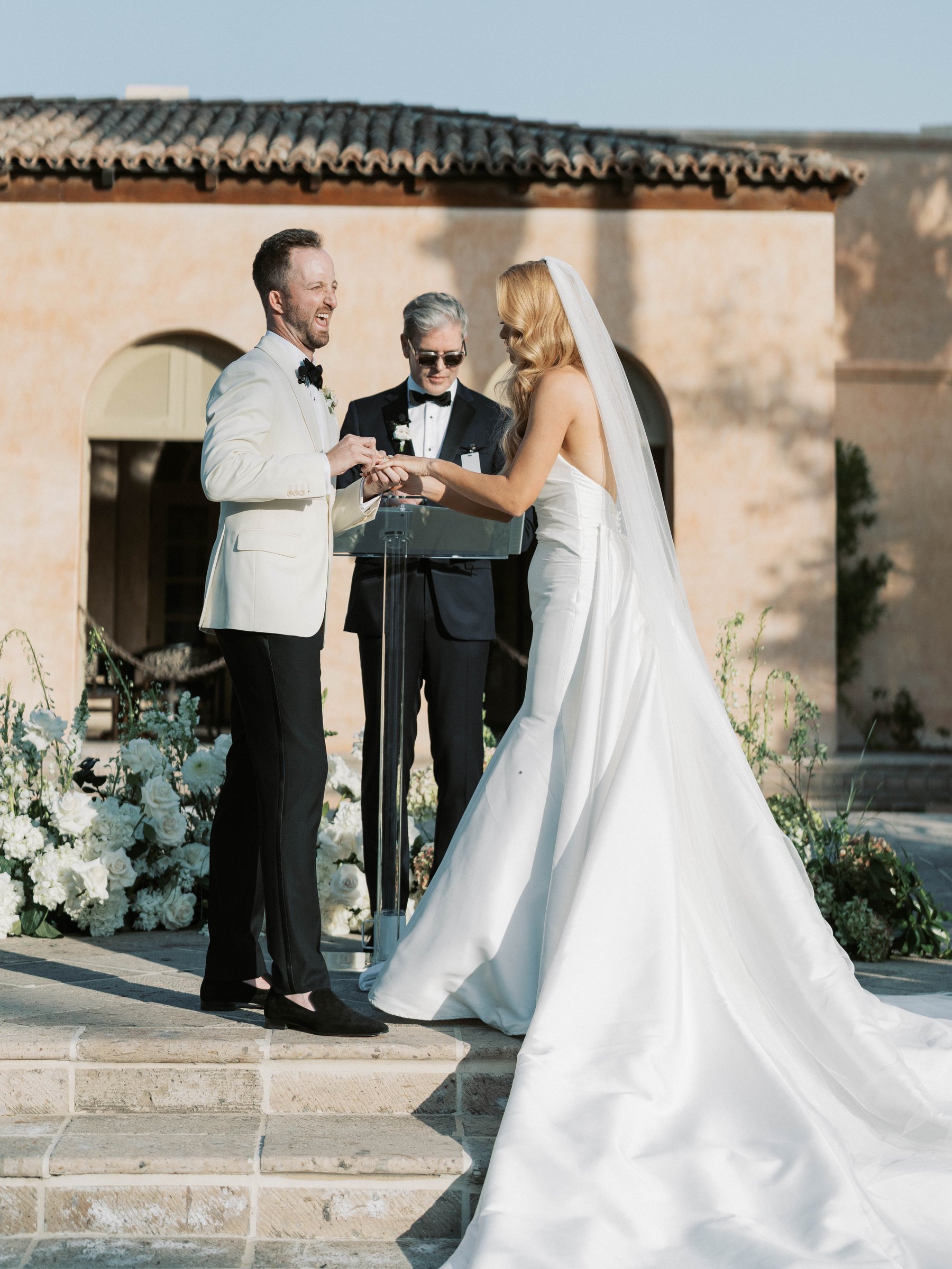 Meg and Peter exchange rings at their Royal Palms ceremony