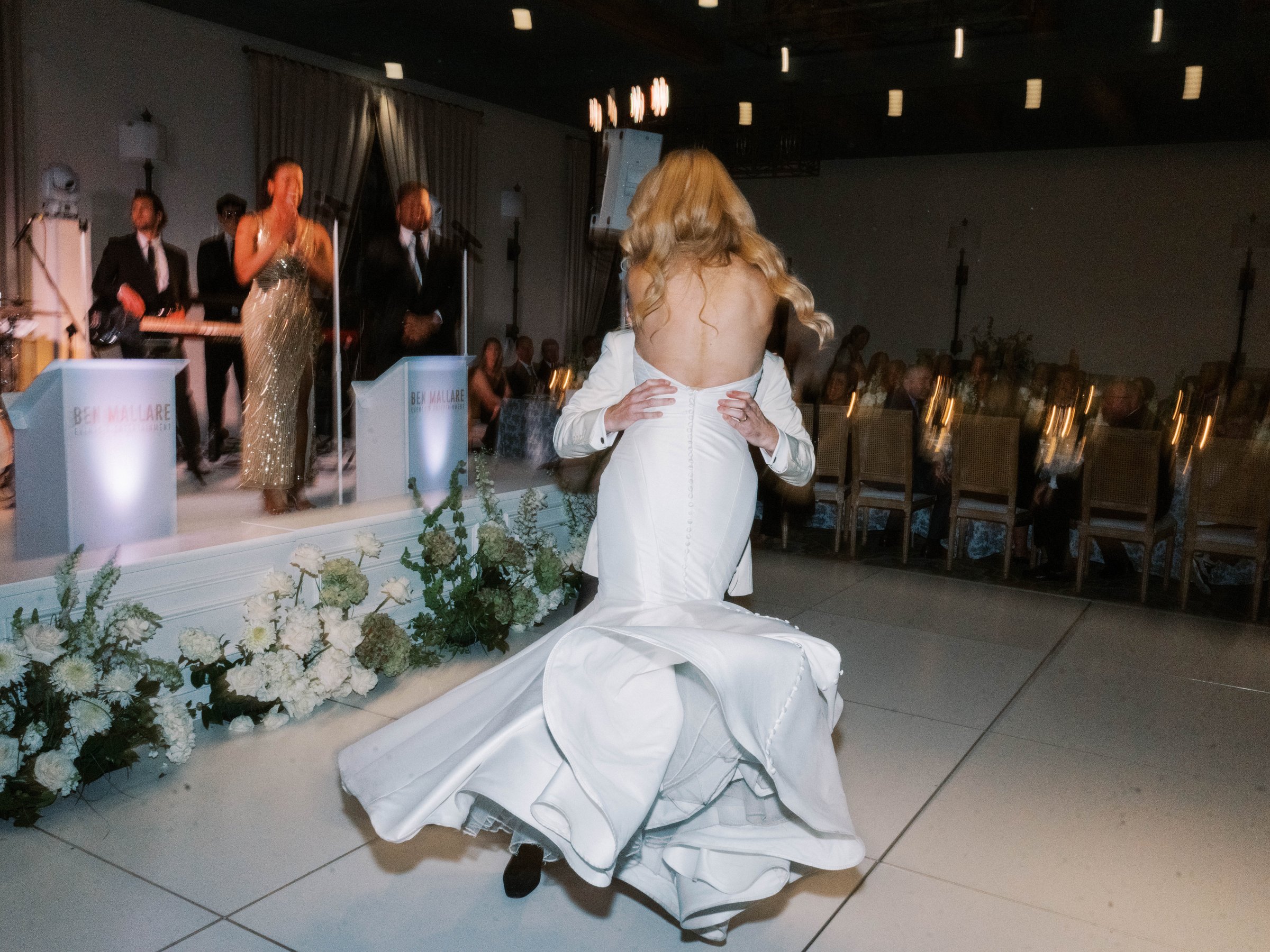 Meg’s gown moves across the dance floor during the first dance