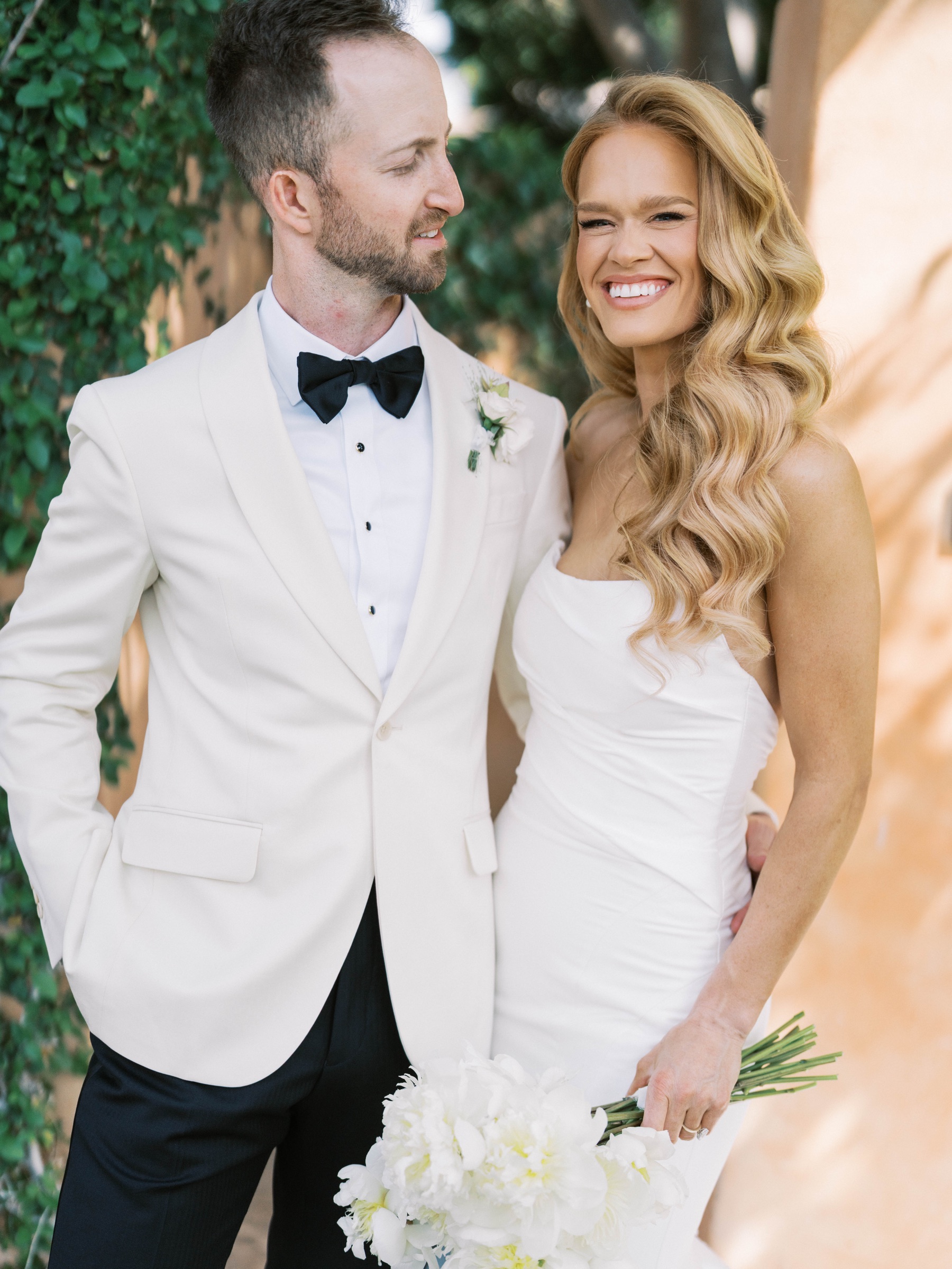 Meg and Peter share a smile in the Royal Palms garden
