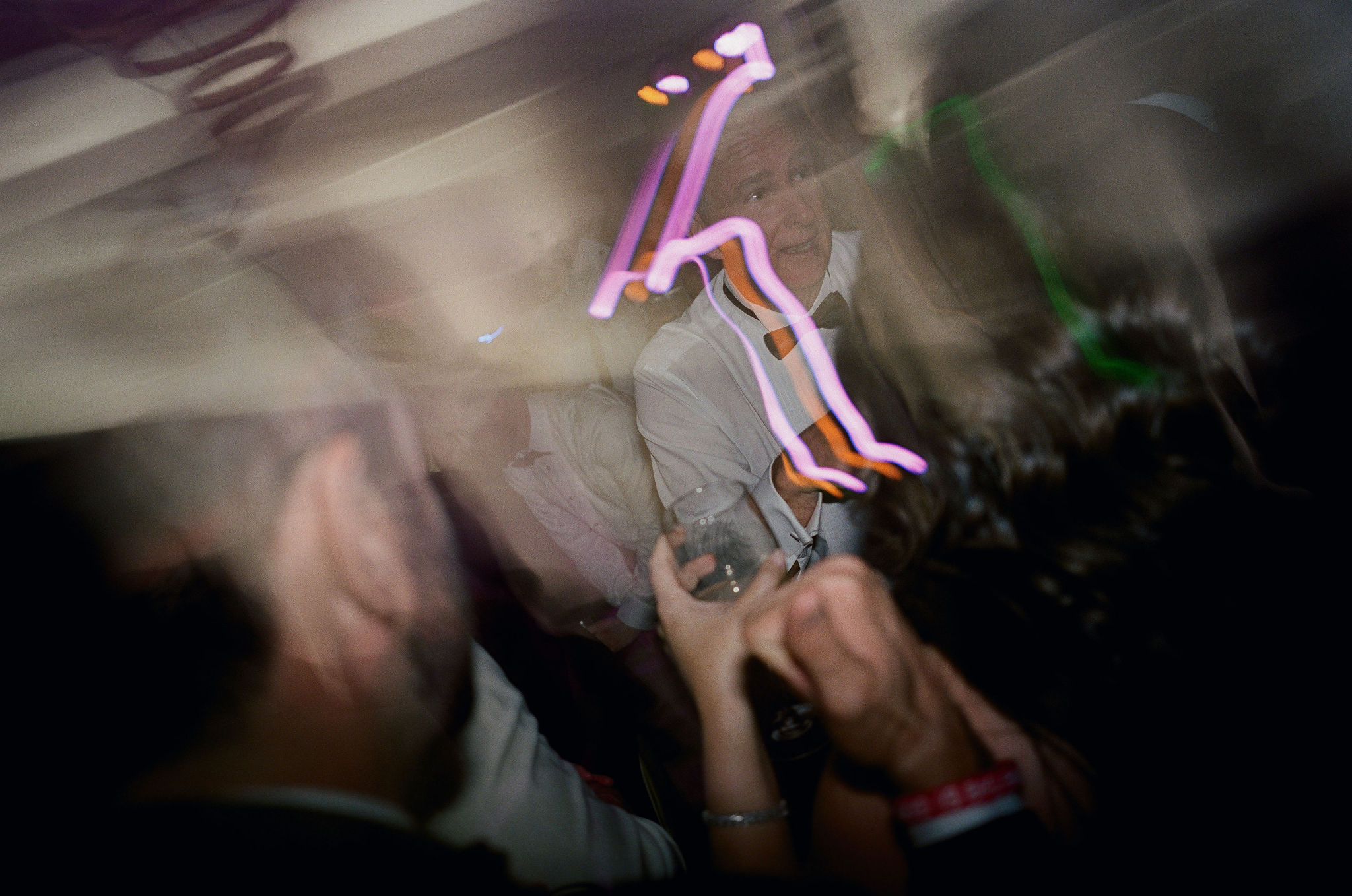 Ryan on the dance floor amid expressive trails of light on film.