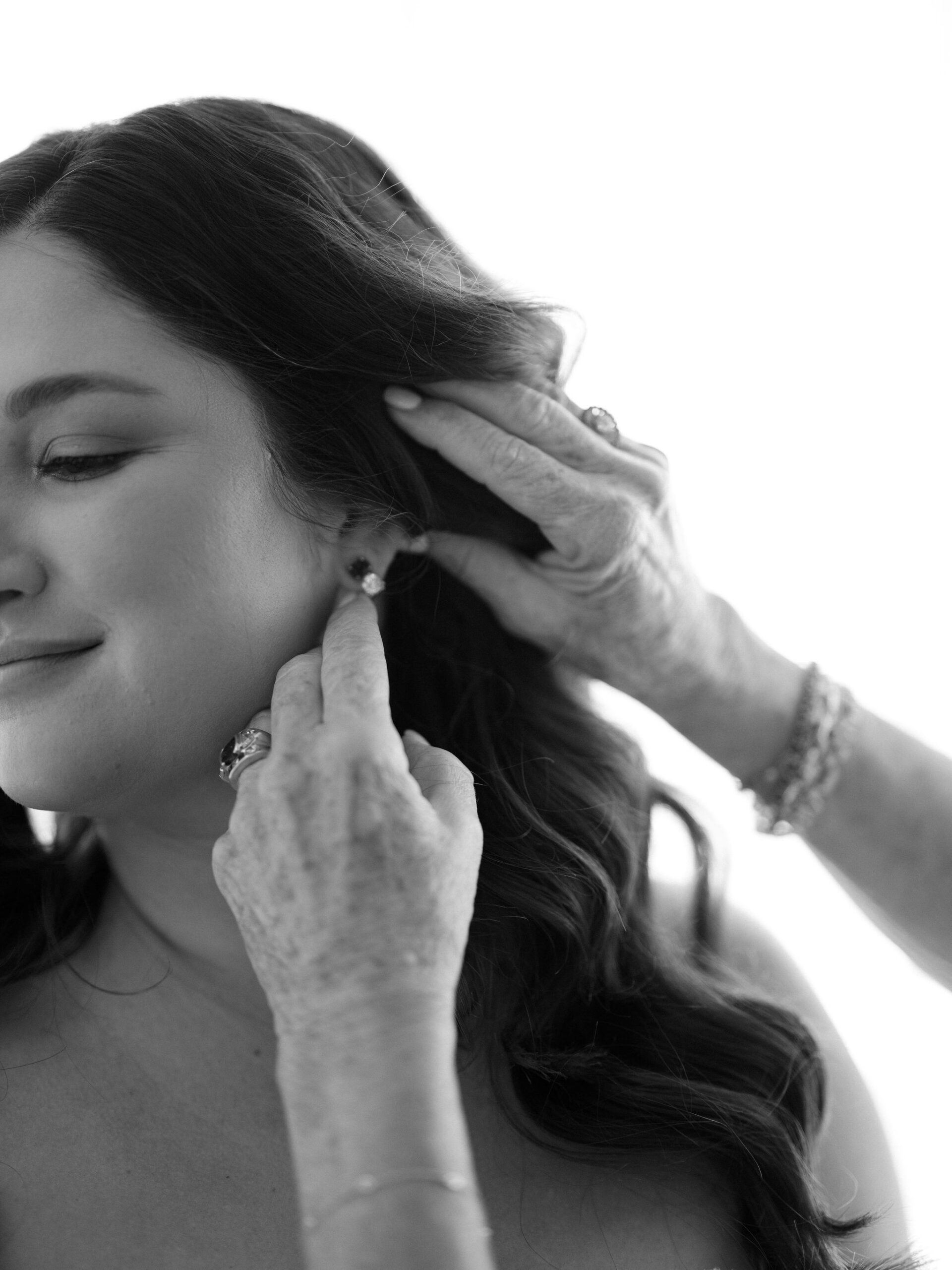 A close view of Taylor as her earring is adjusted.