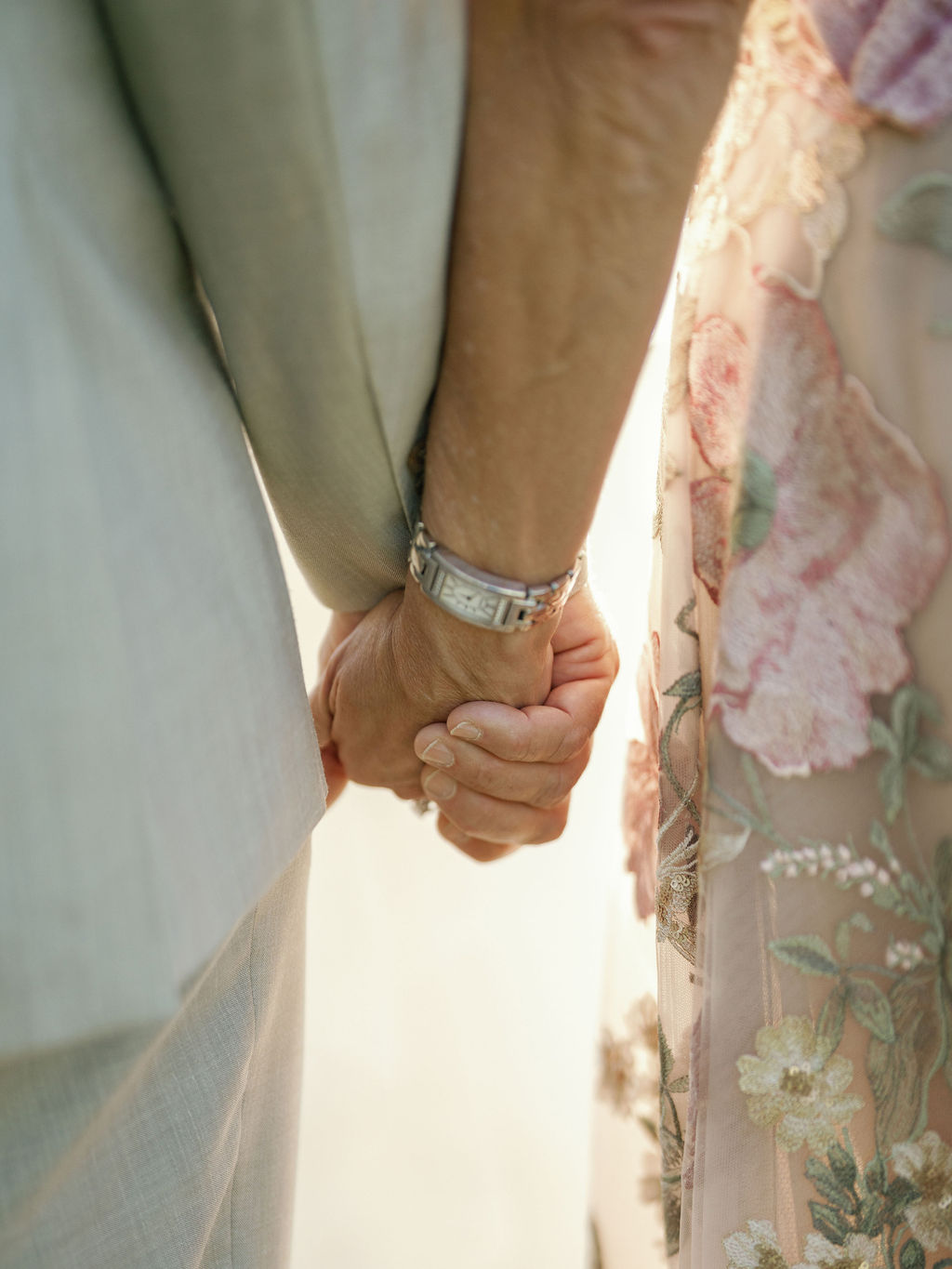 Detail shot of the newlyweds' hands and rings
