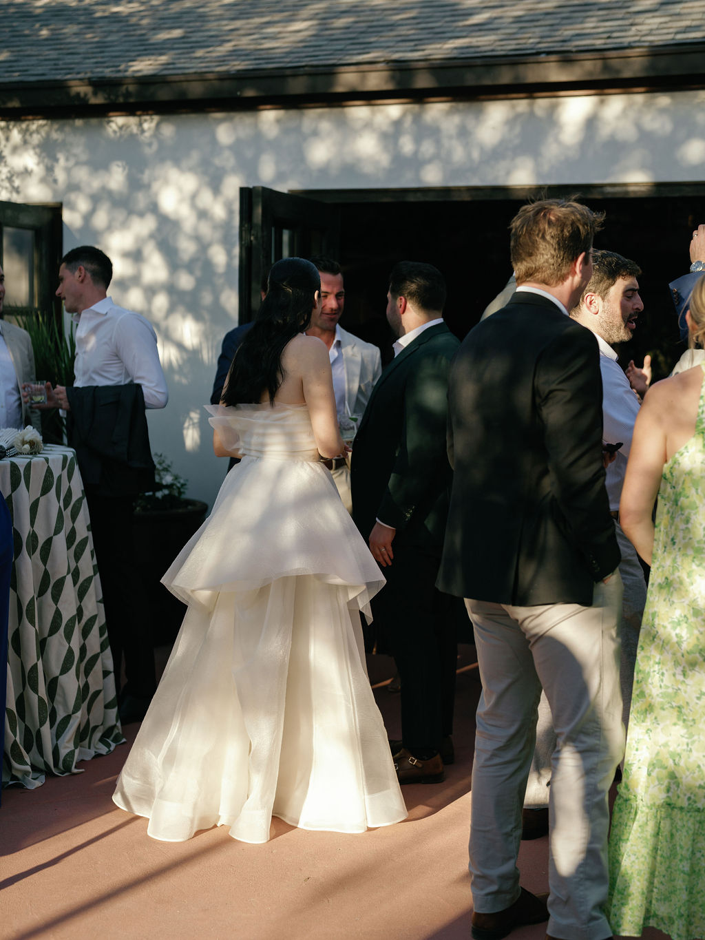 Guests mingling during cocktail hour on the Casa Paloma patio