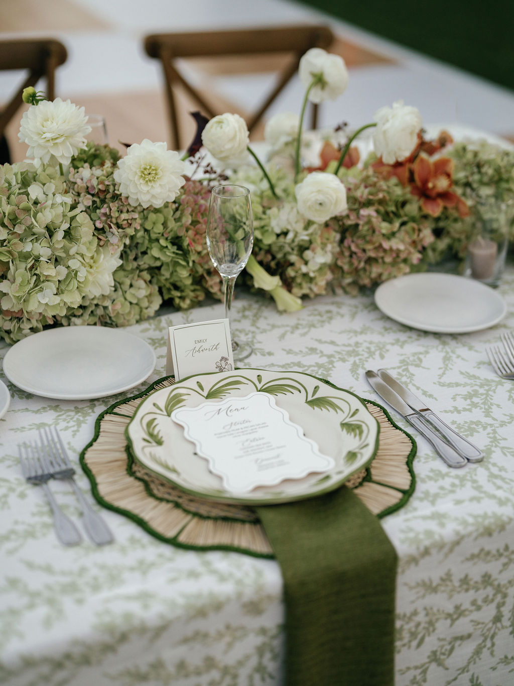 Place setting detail with dahlias at the reception table